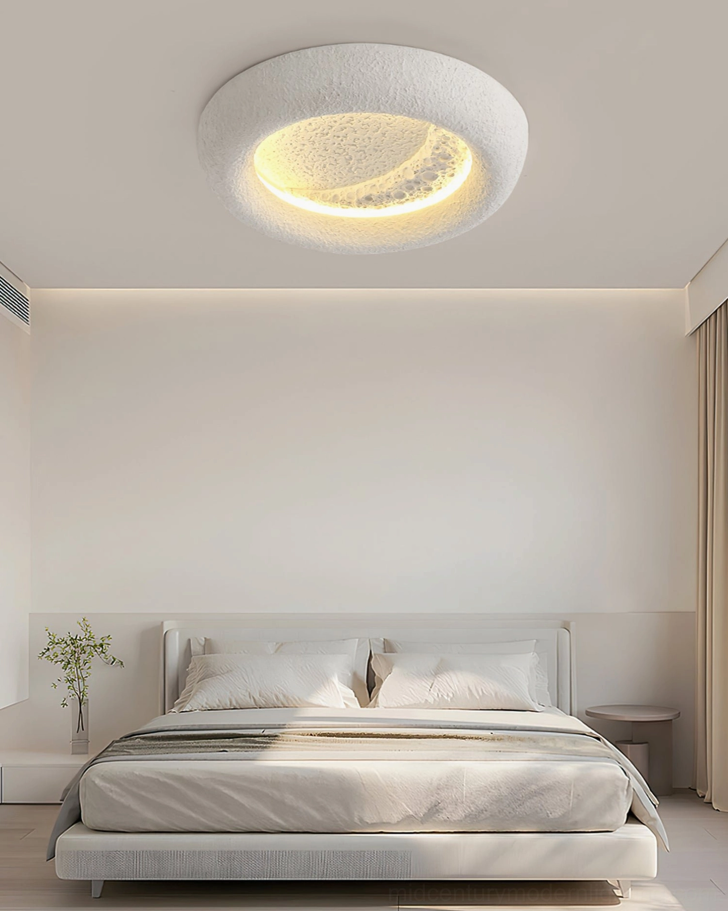 Mid-century modern lunar ceiling fixture creating soft warm lighting in minimalist bedroom with wabi-sabi aesthetic