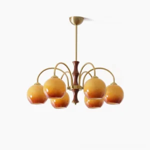 6-head mid-century modern satellite ball chandelier with gradient amber glass shades, brass metal arms, and walnut wood central axis against white studio background