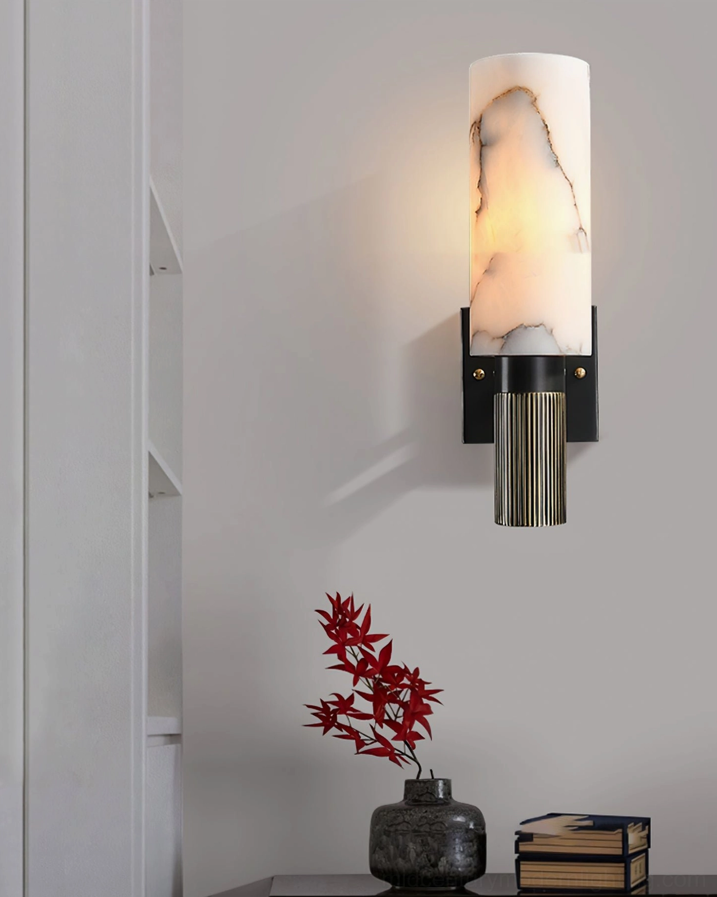 Mid-century modern alabaster cylinder wall lamp with natural stone finish and brass hardware