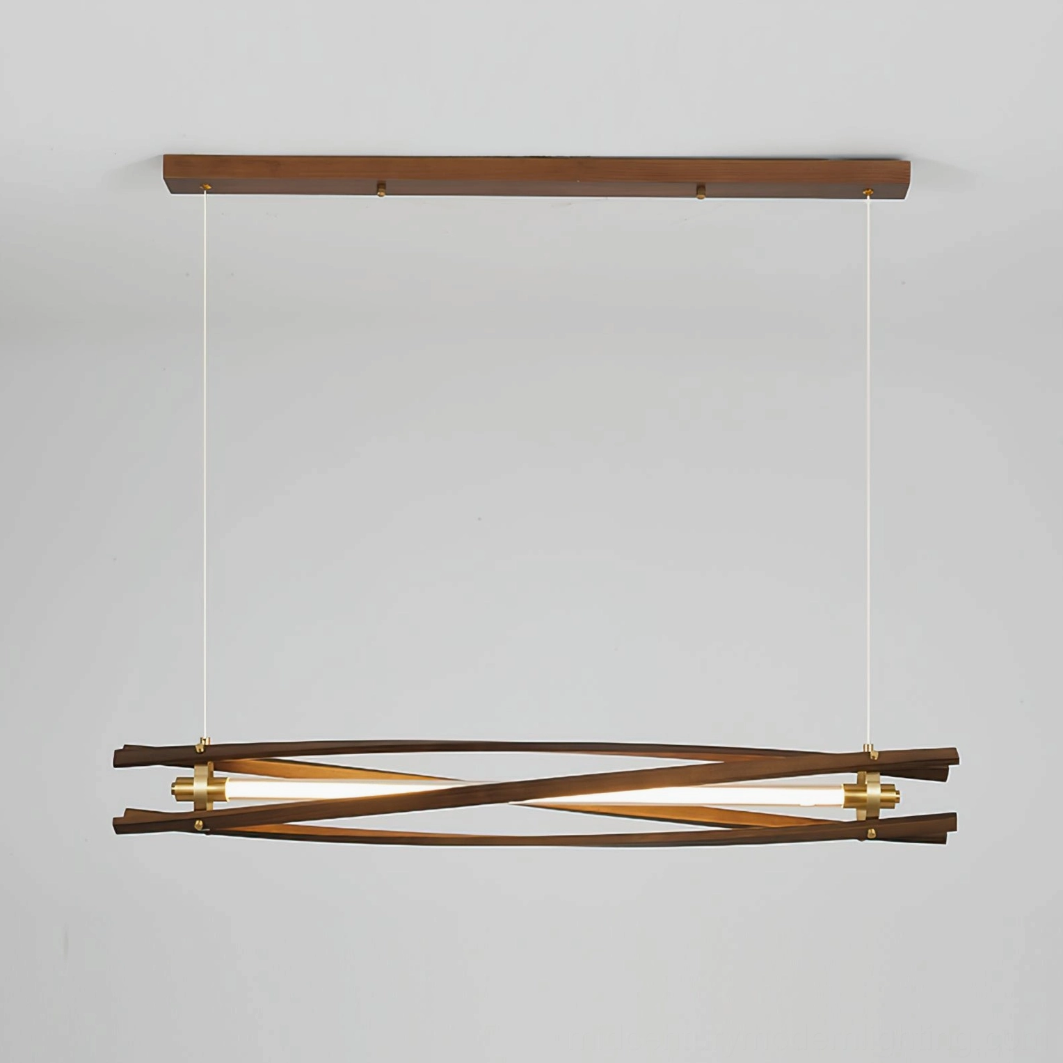 Mid-century modern wood chandelier installation showing geometric crisscross design and brass accents in contemporary interior