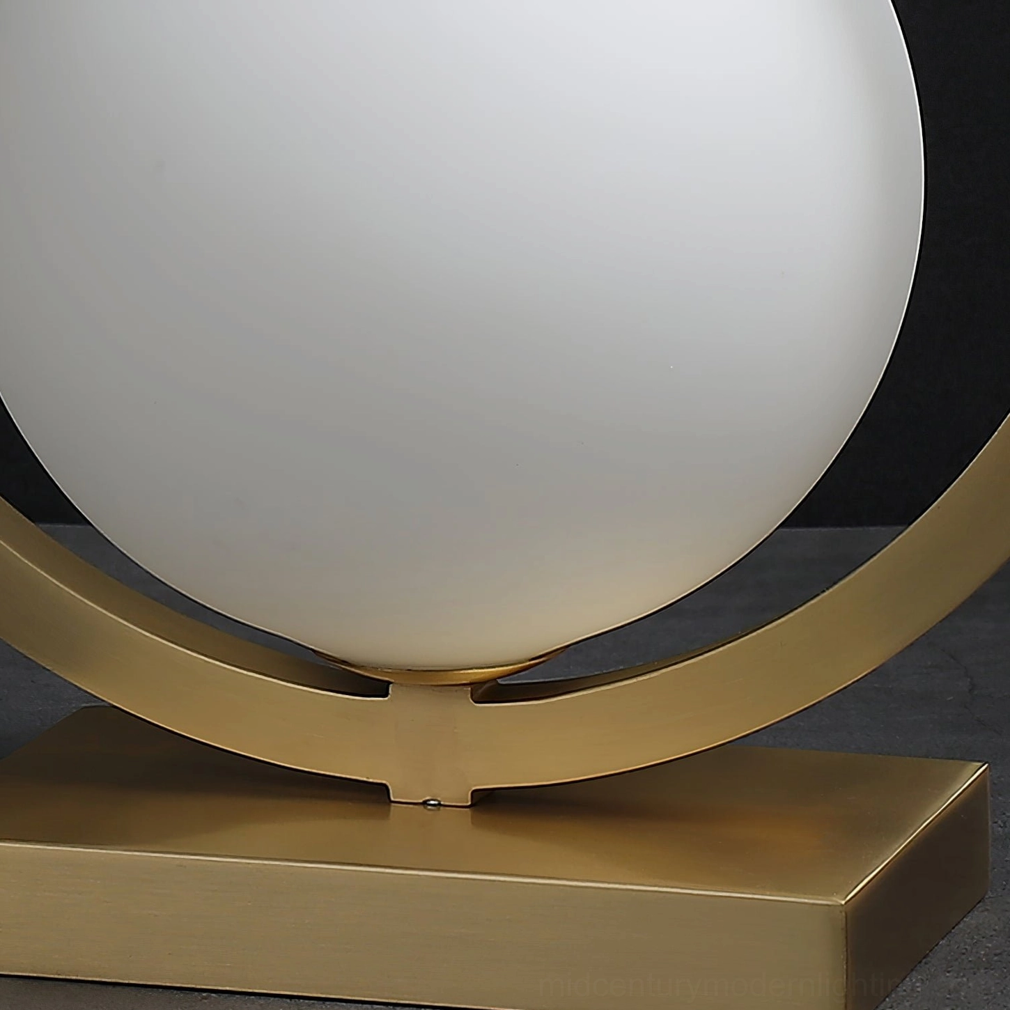 Mid-century modern brass table lamp with G9 socket compatibility and universal voltage design