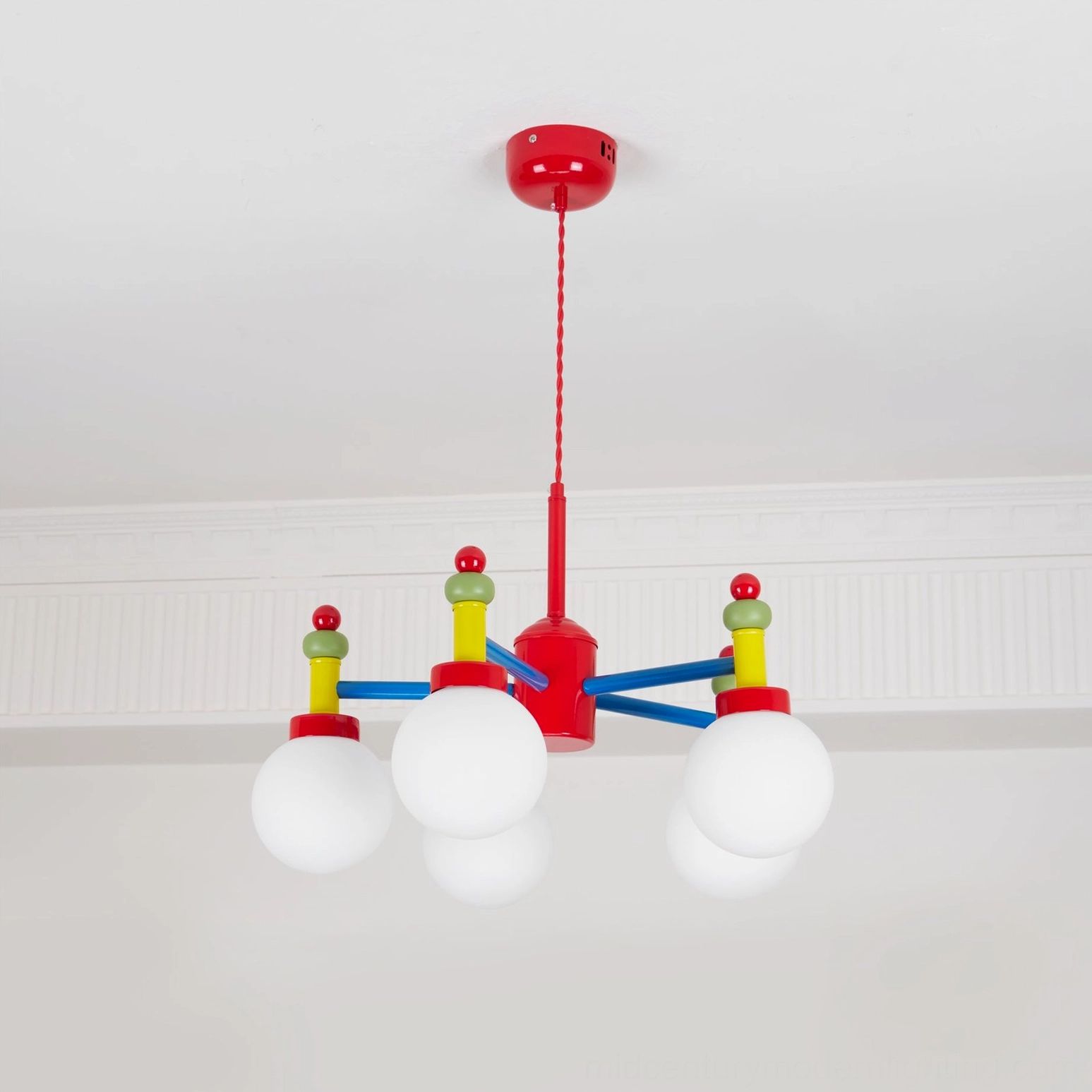 Colorful glass pendant light fixture in mid-century modern style with vibrant color palette