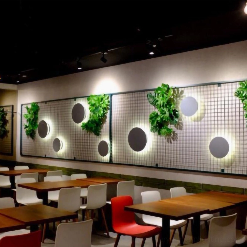 Modern geometric disc wall installation demonstrating mid-century modern design philosophy and sculptural light composition