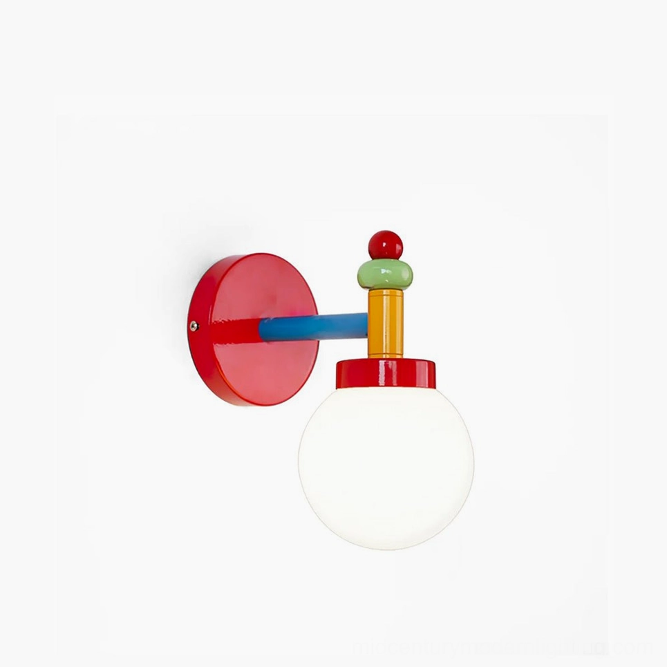 Colorful mid-century modern glass wall sconce with stacked geometric metal hardware in red, green, yellow, and blue finishes