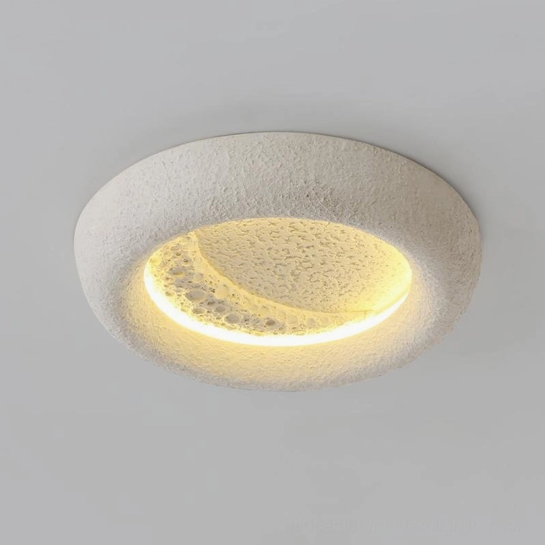 Mid-century modern ceiling light with frosted white matte finish and crescent moon light effect close-up detail