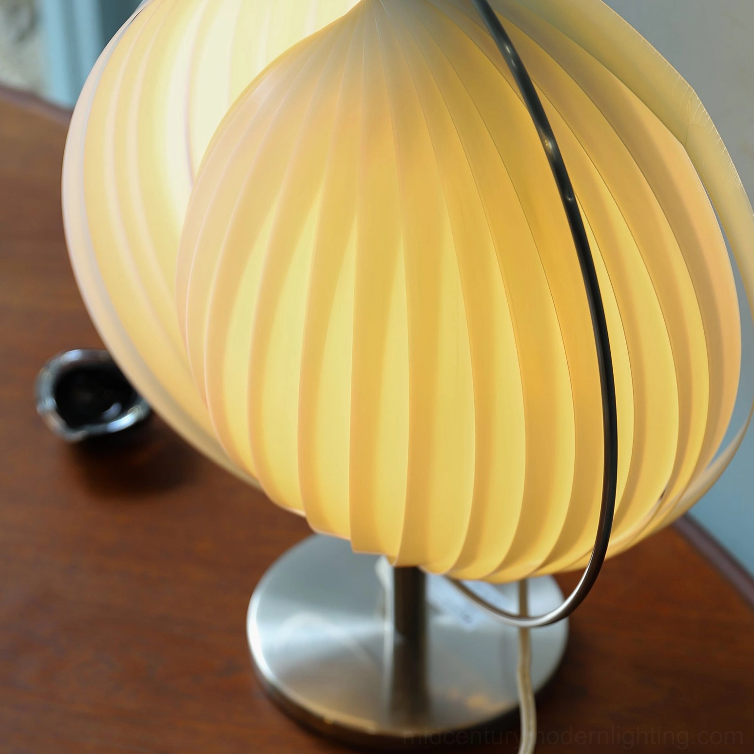 Moon Kare rotatable globe table lamp mid-century modern design with pleated white shade and metallic base