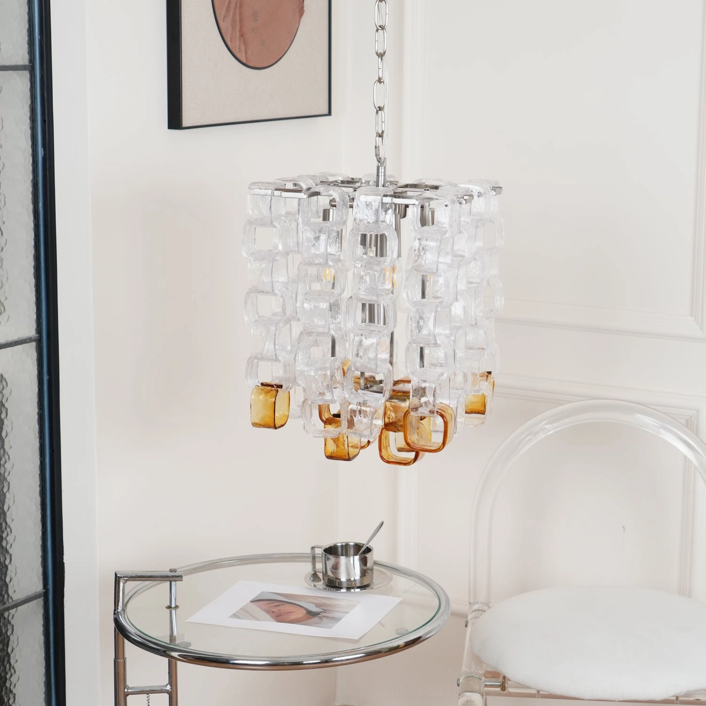 Mid-century modern Murano glass chandelier with amber and clear glass, exemplifying minimalist design philosophy and craftsmanship