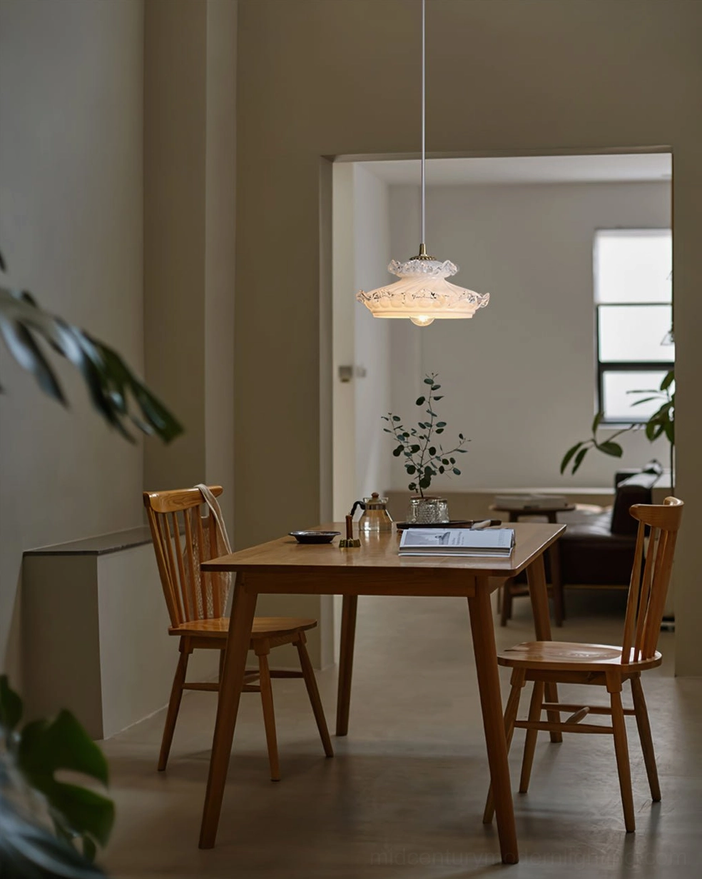 Mid-century modern pendant lamp with ruffled glass edge and brass finish hardware