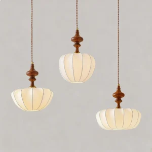 Set of three mid-century pendant lights with beige ribbed fabric shades and twisted brown cords, minimalist backdrop