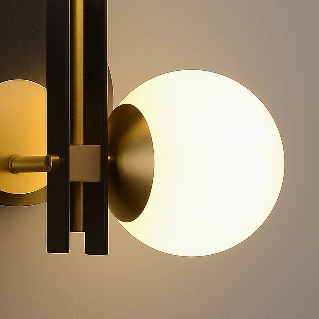 Planeta mid-century modern dual globe wall sconce, black and brass materials, frosted glass ambient lighting