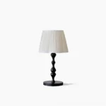 Ambrosia mid-century modern table lamp with pleated fabric shade and turned wooden base, front view on white background
