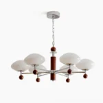 Modern mid-century pointed chandelier overhead view - studio photography showing chrome arms with walnut spheres and frosted white glass shades