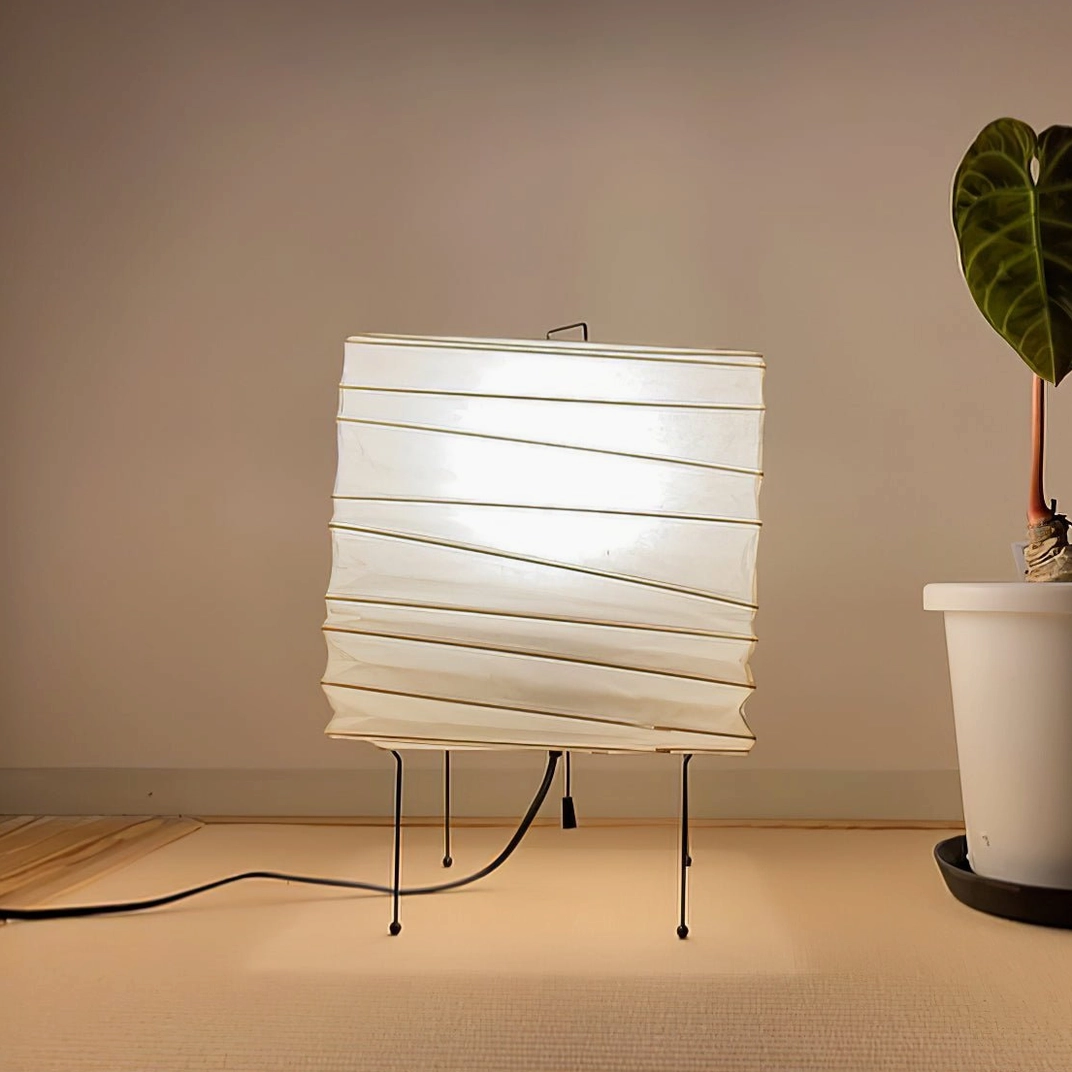 Mid-century modern organic paper table lamp with sculptural cylindrical form, artistic lighting sculpture for contemporary interior design