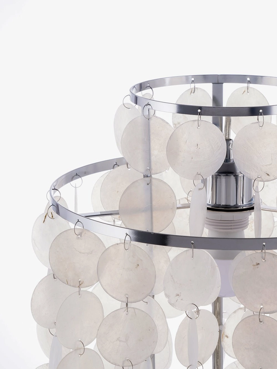 Mid-century modern mother-of-pearl shell table lamp in stylish home setting