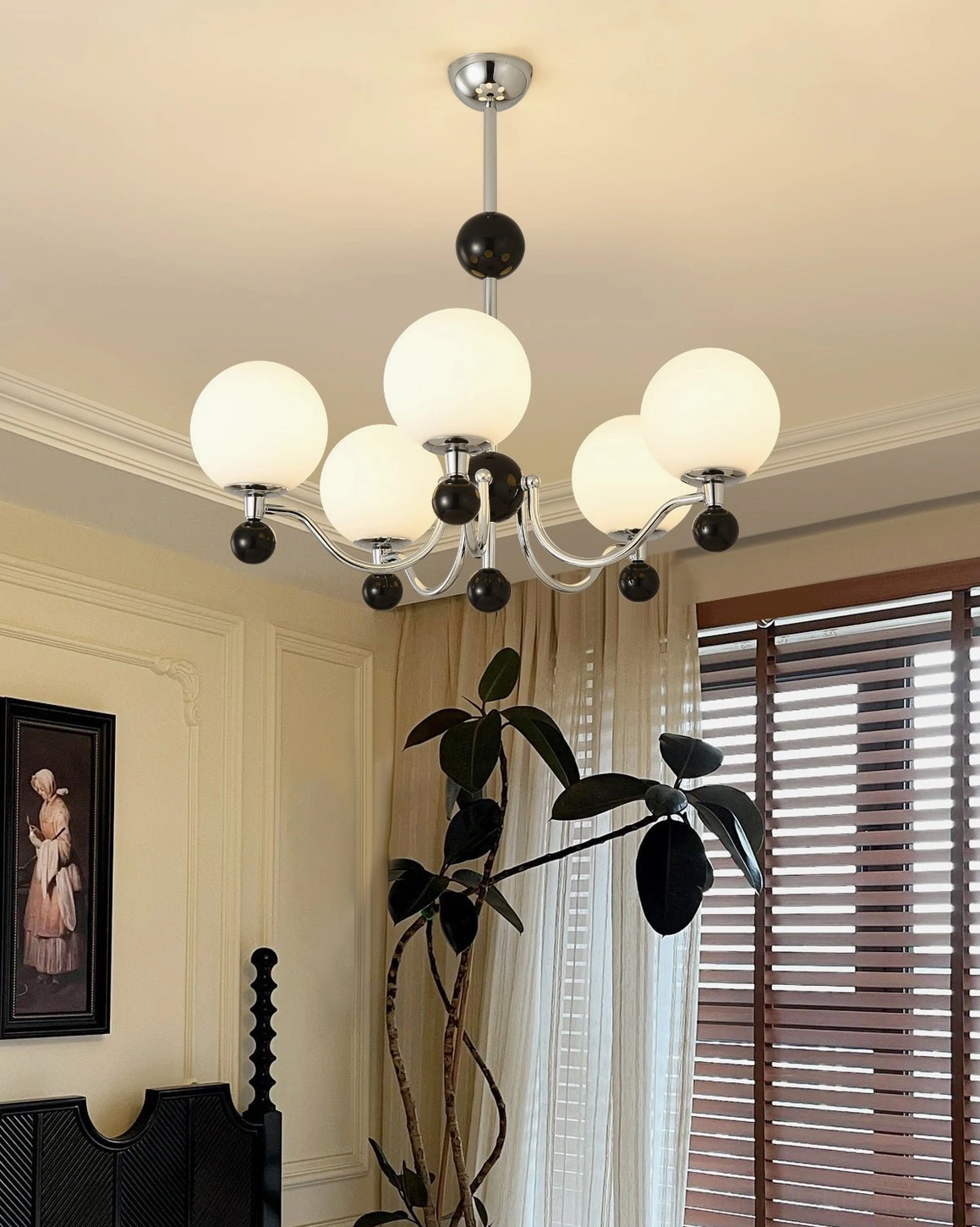 Mid-century modern inspired spherical chandelier with black accent spheres suspended from chrome frame