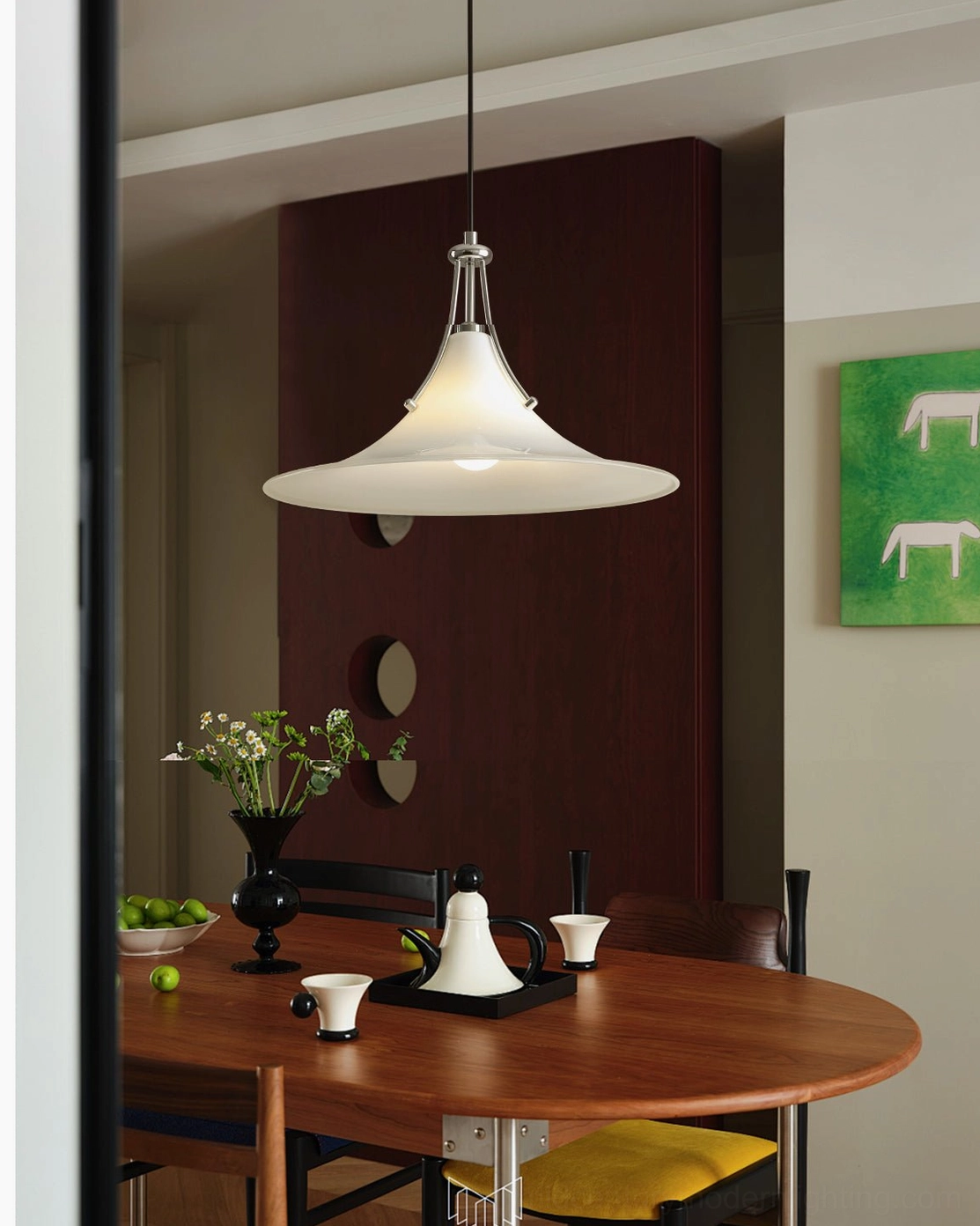 Mid-century modern swing arm pendant in vintage wooden dining room, warm white frosted shade creating ambient lighting over round wooden table