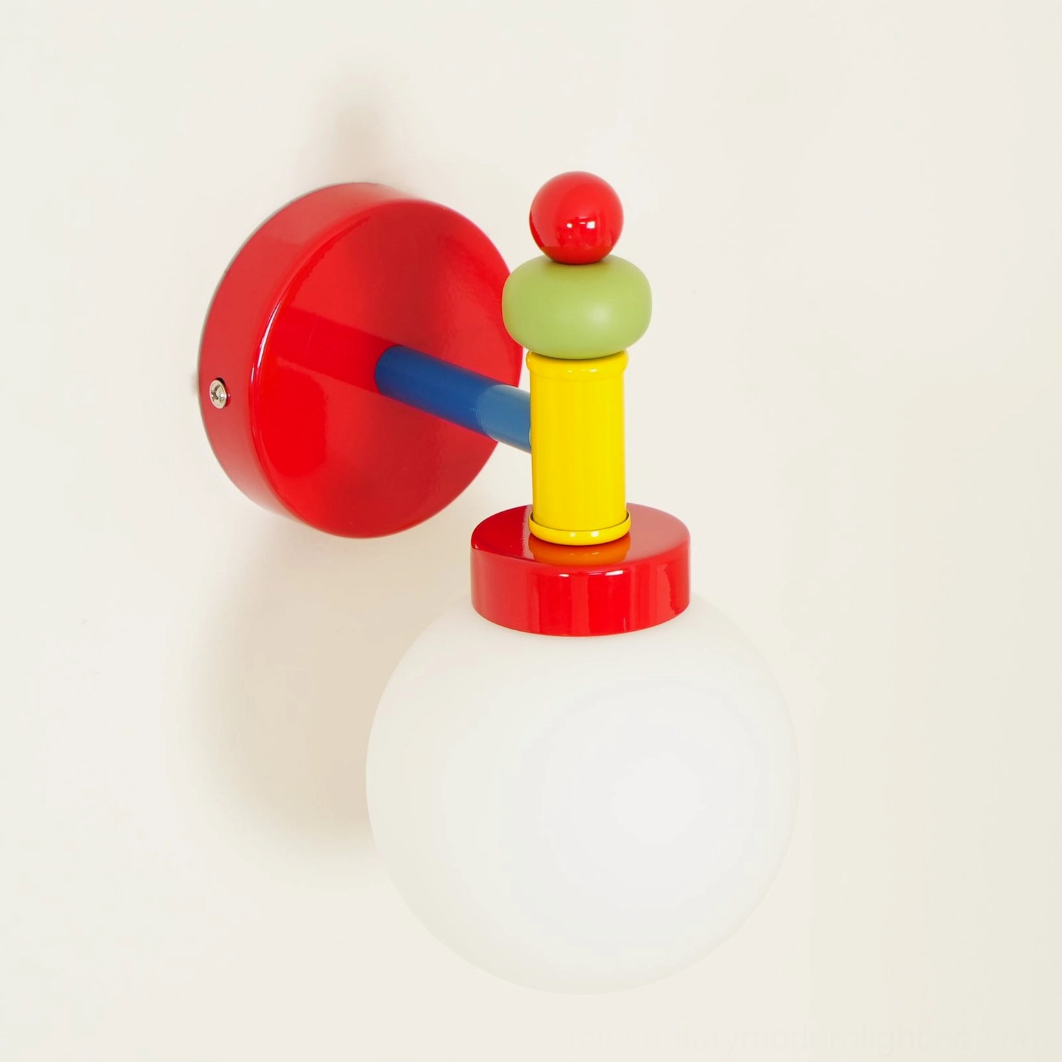Artistic shot of geometric wall sconce highlighting color coordination and design balance