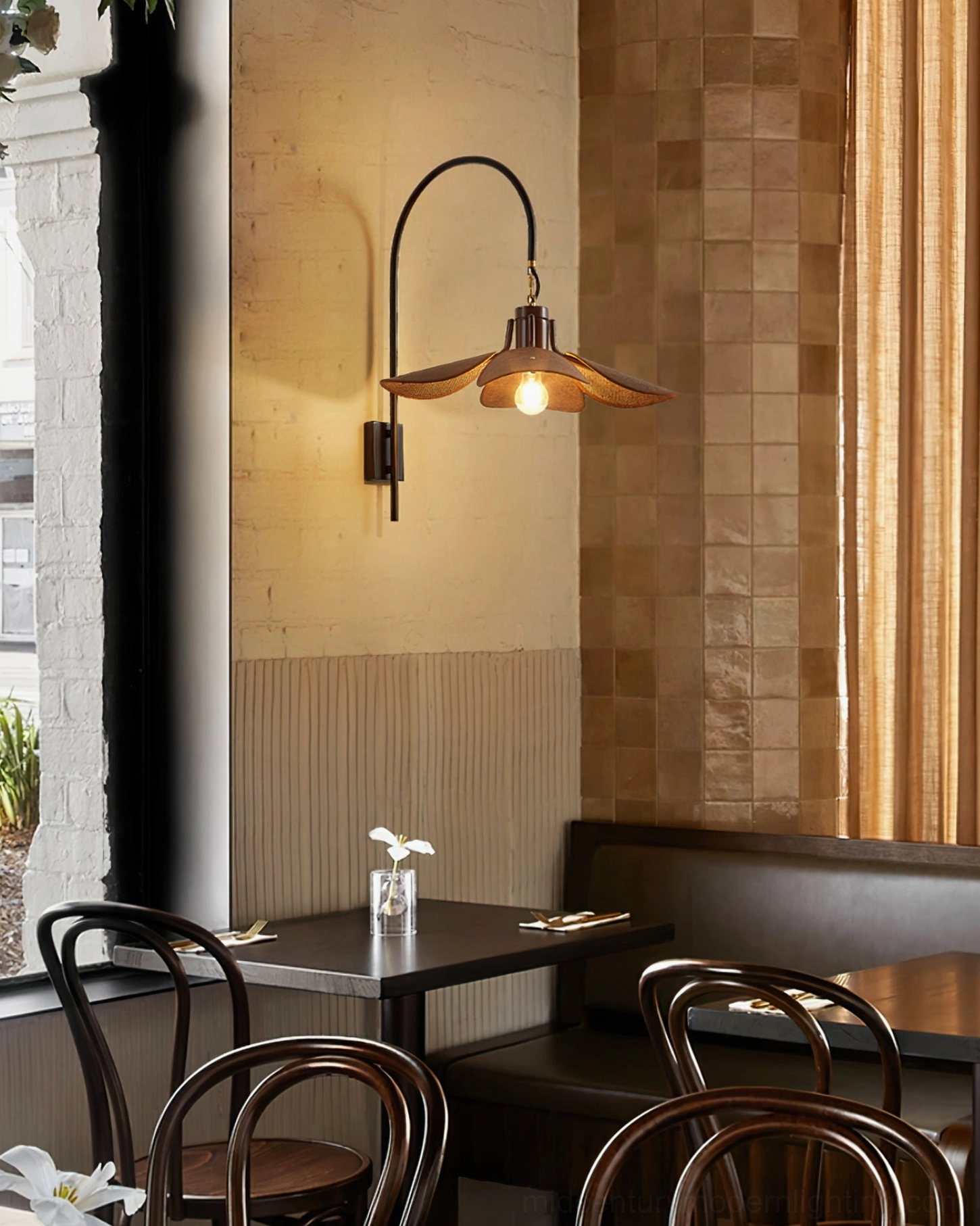 Riankh mid-century modern wall lamp showing sculptural metal form and fabric shade design