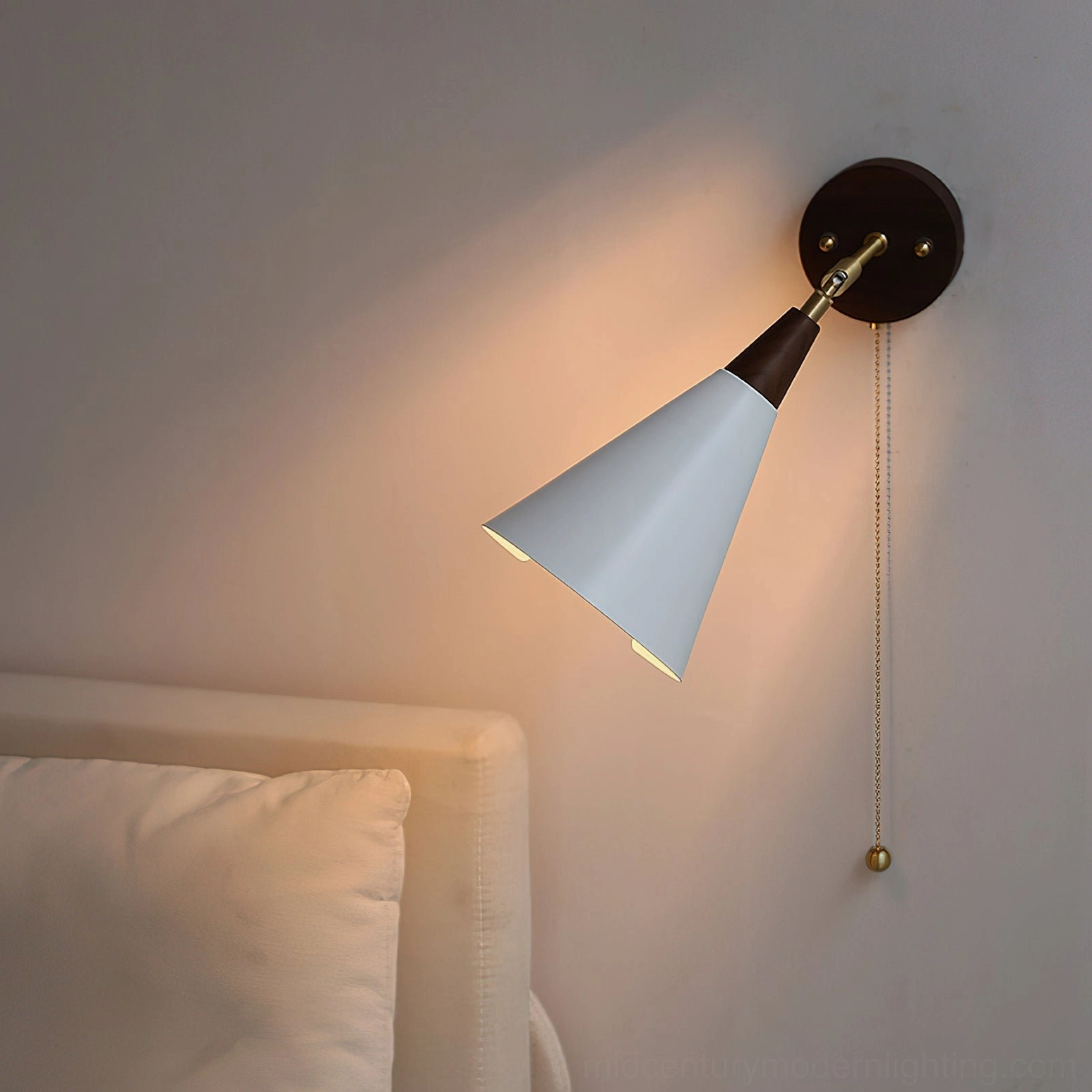 Fleka mid-century modern wall sconce in walnut and brass, product display emphasizing Scandinavian design and articulating arm