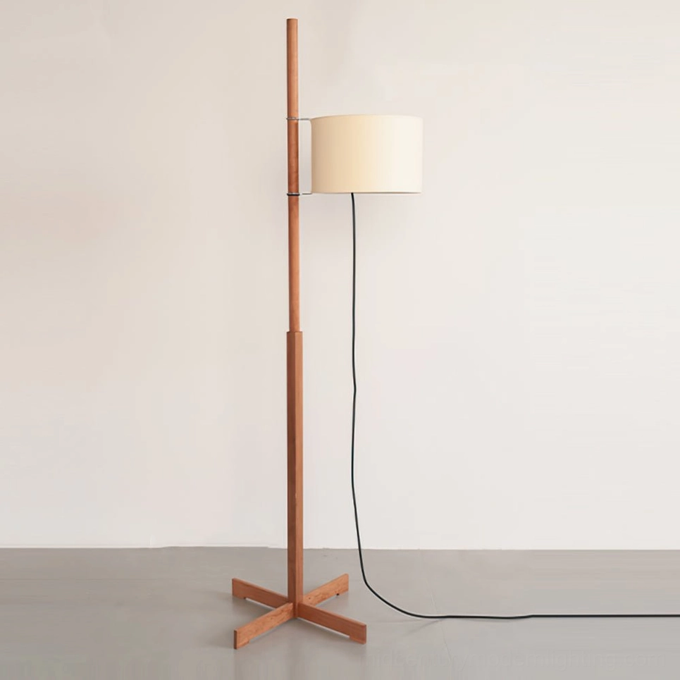 Minimalist wood floor lamp with fabric shade showing sleek pole design and black power cord