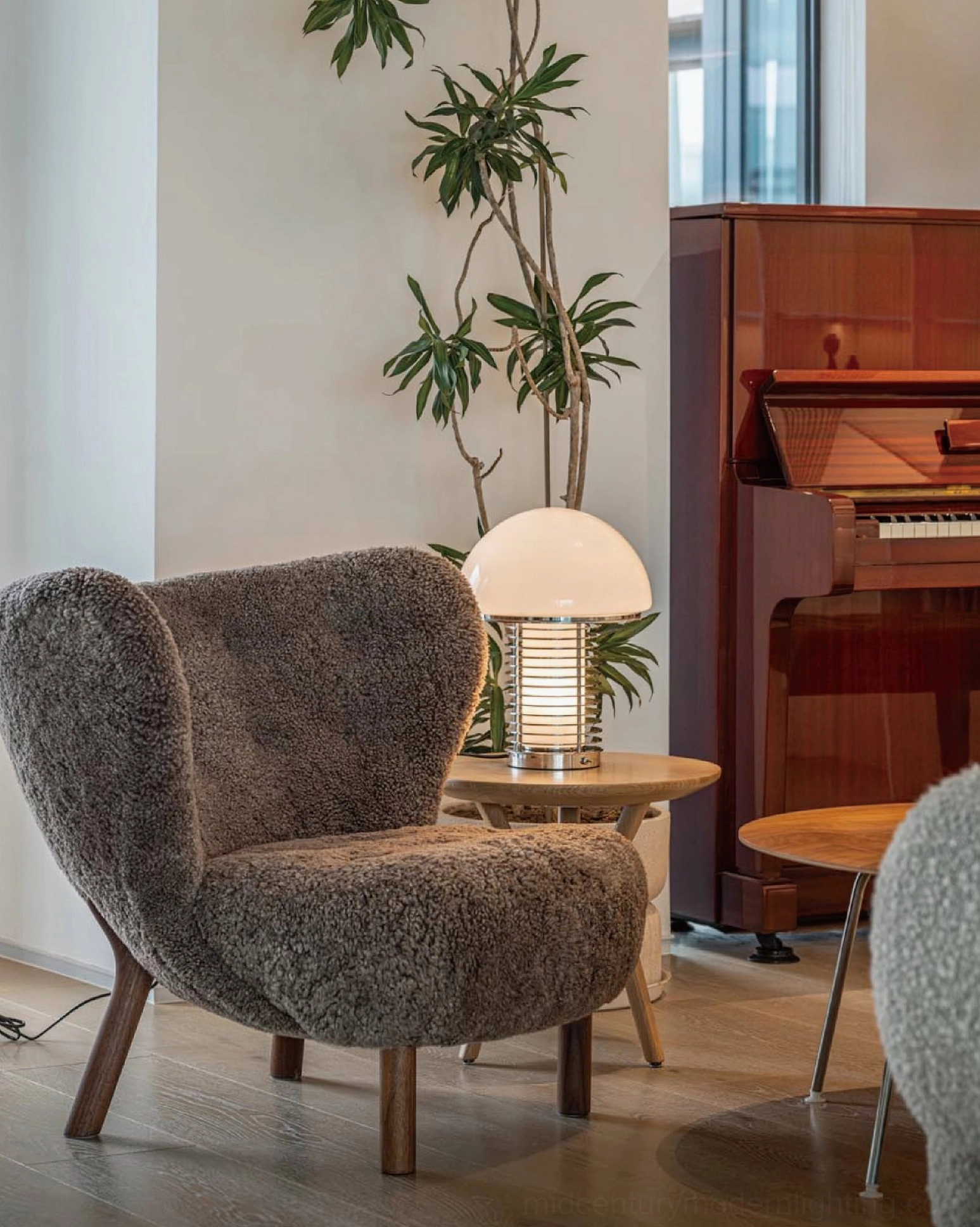 Mushroom table lamp placed on side table in retro home living room with vintage furniture pairing