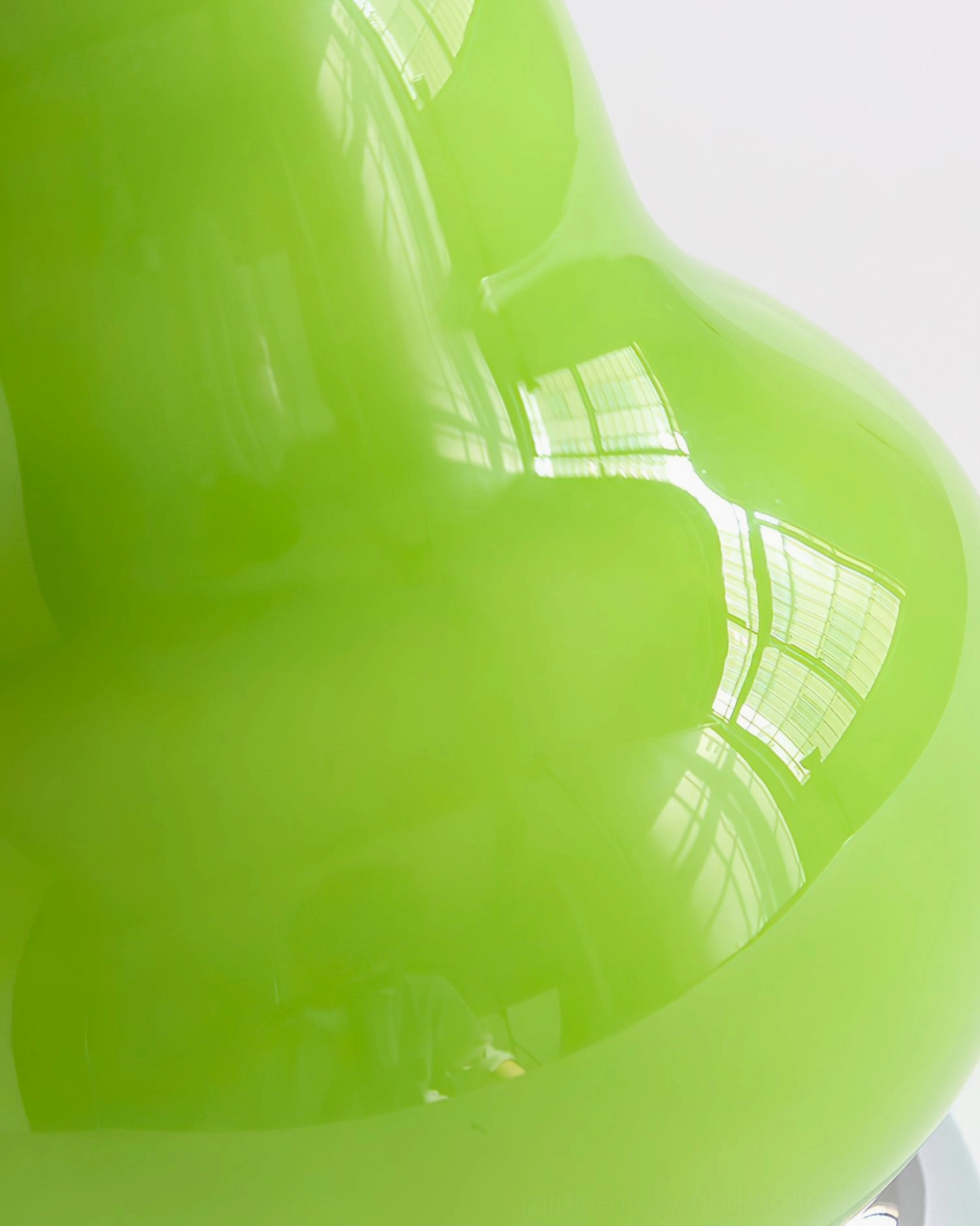 Mid-century modern pear glass rechargeable table lamp, sculptural form with warm LED light on minimalist surface