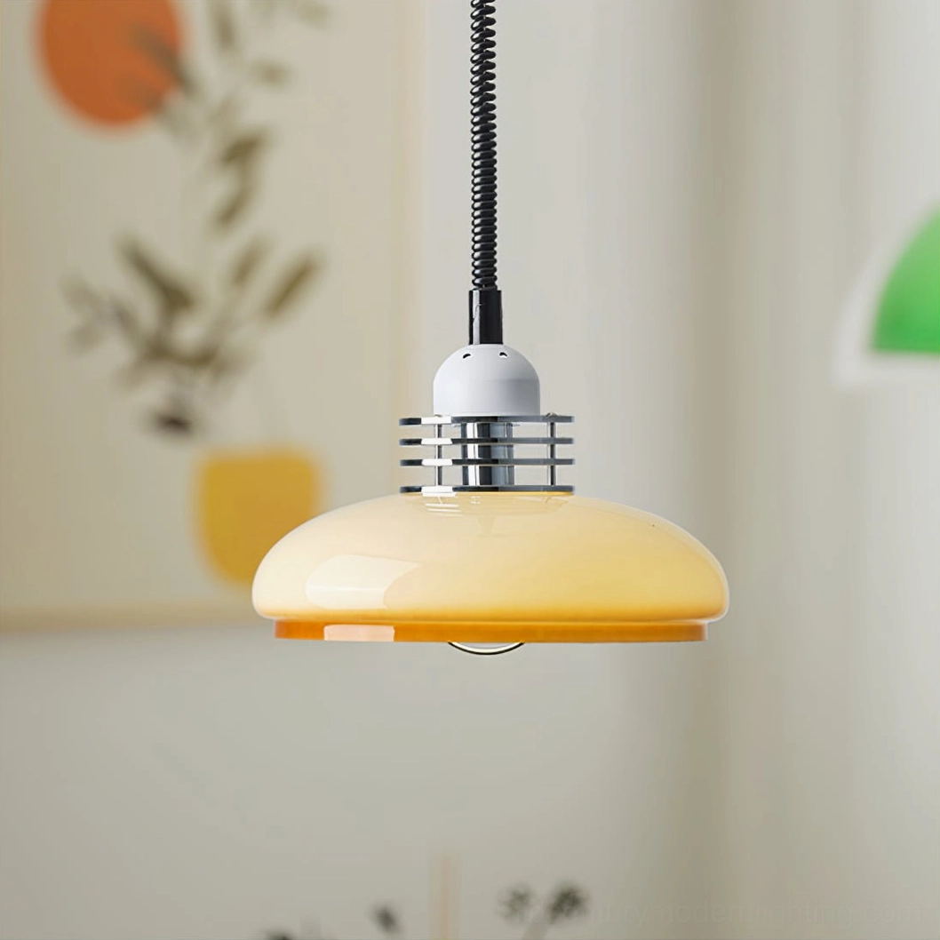 Close-up side detail of mid-century modern pendant lamp showing chrome trim and black spiral power cord connection