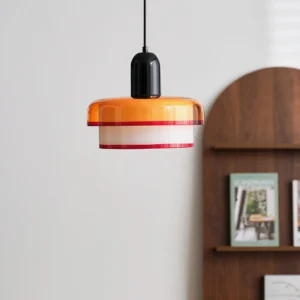 Mid-century modern pendant lamp with warm retro color palette displayed on wooden wall shelf