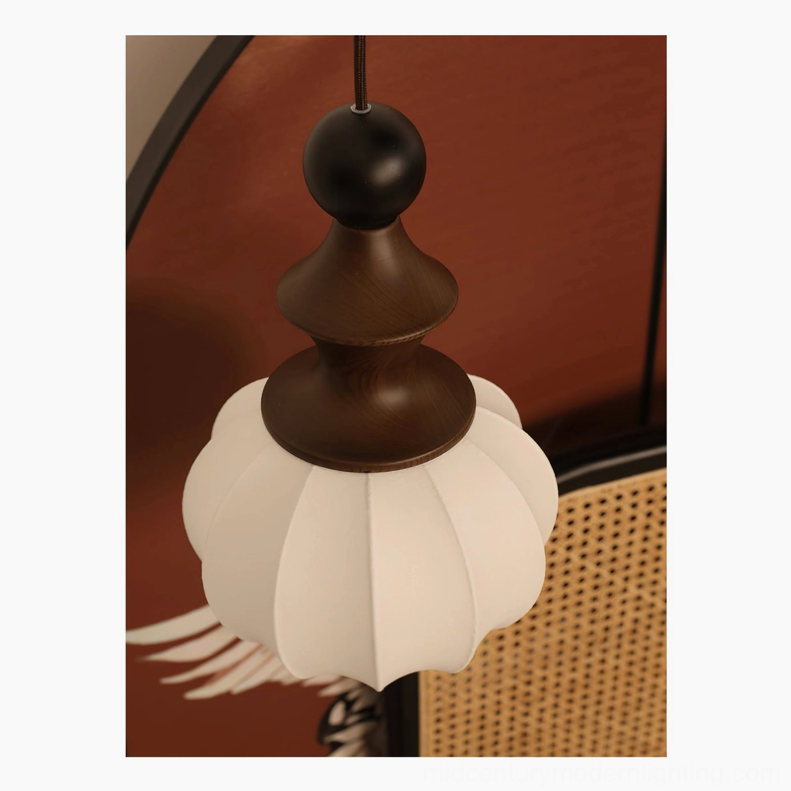 Complete mid-century modern pendant light with stacked wood base and ribbed fabric lampshade close-up frontal view showing textured details