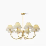 Mid-century modern pleated shade chandelier with polished brass frame and white accordion pleats - front studio view
