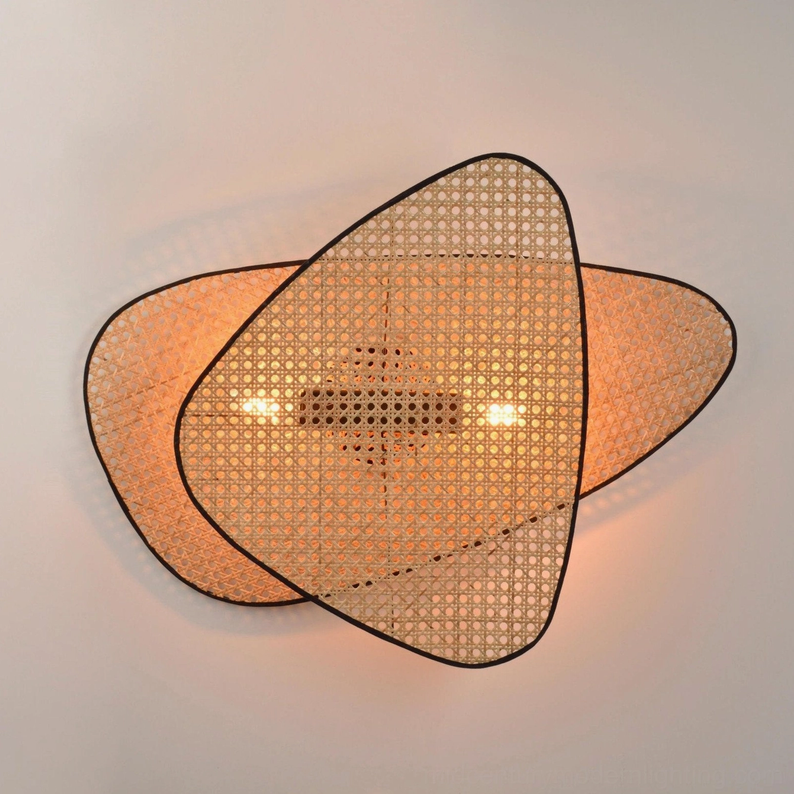 Mid-century modern rattan wall lamp installation multiple sizes showing scale options and design flexibility