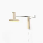 Mid-century modern swing arm wall light with cream shade and polished chrome hardware, front view on white background
