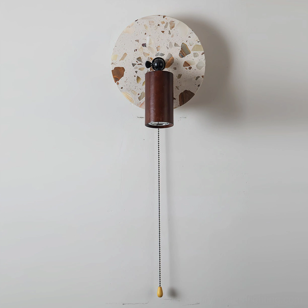 Swizzle mid-century modern terrazzo wall lamp featuring hand-cast stone backplate with organic earth-tone mosaic and integrated LED technology