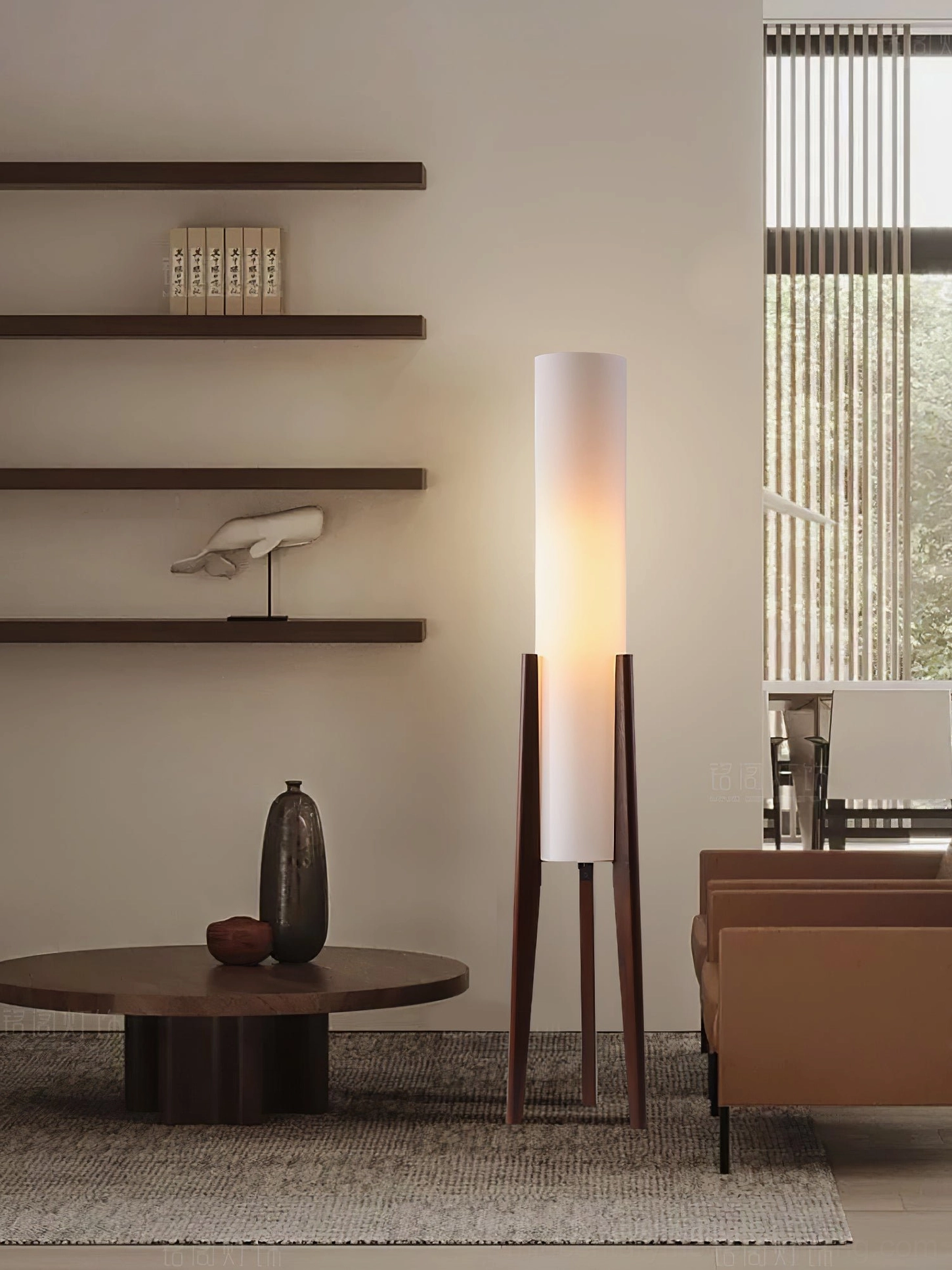 Minimalist walnut tripod floor lamp in contemporary living room with wall shelves and round table