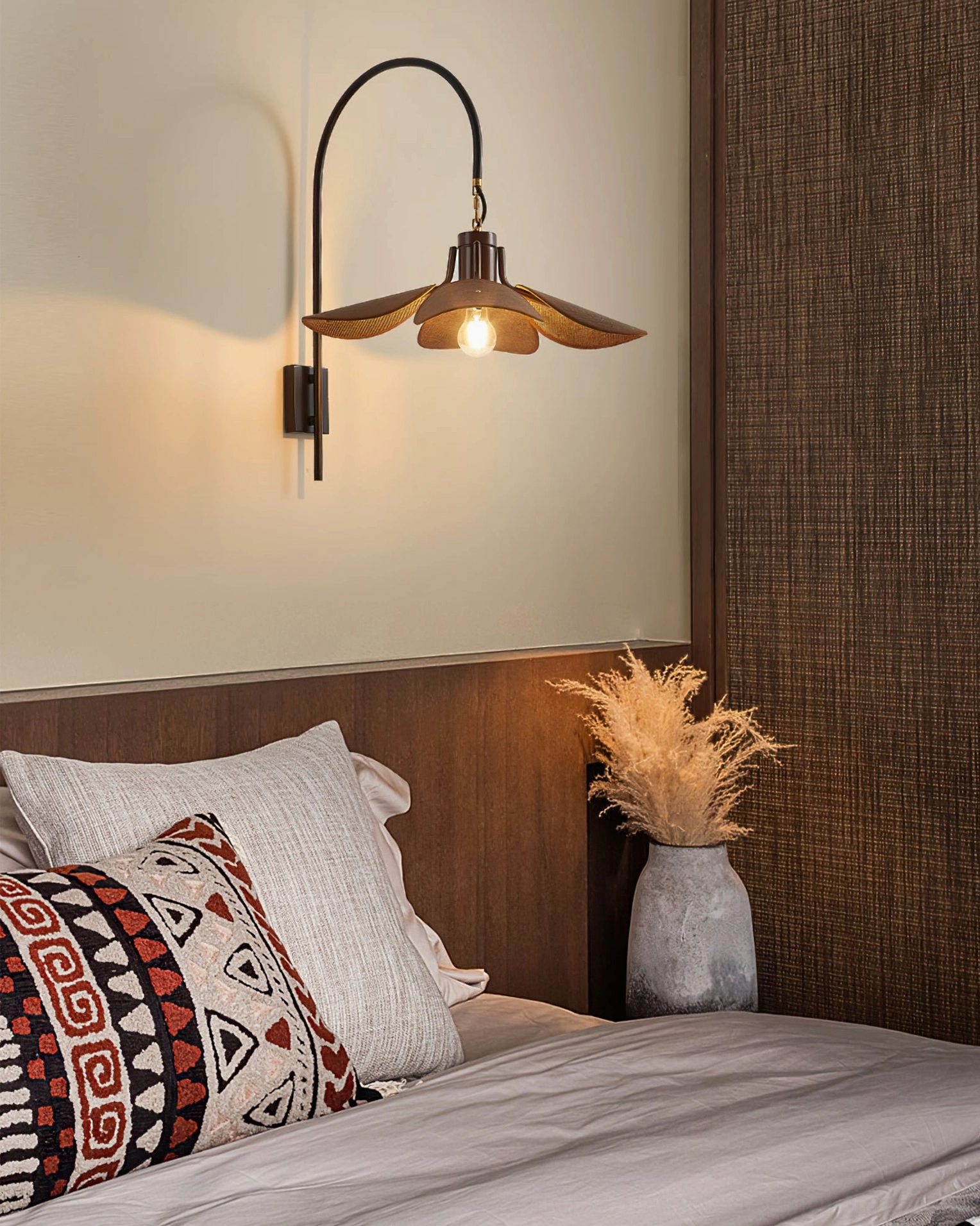 Riankh wall lamp installed above bedside furniture in bedroom, creating warm vintage ambient lighting