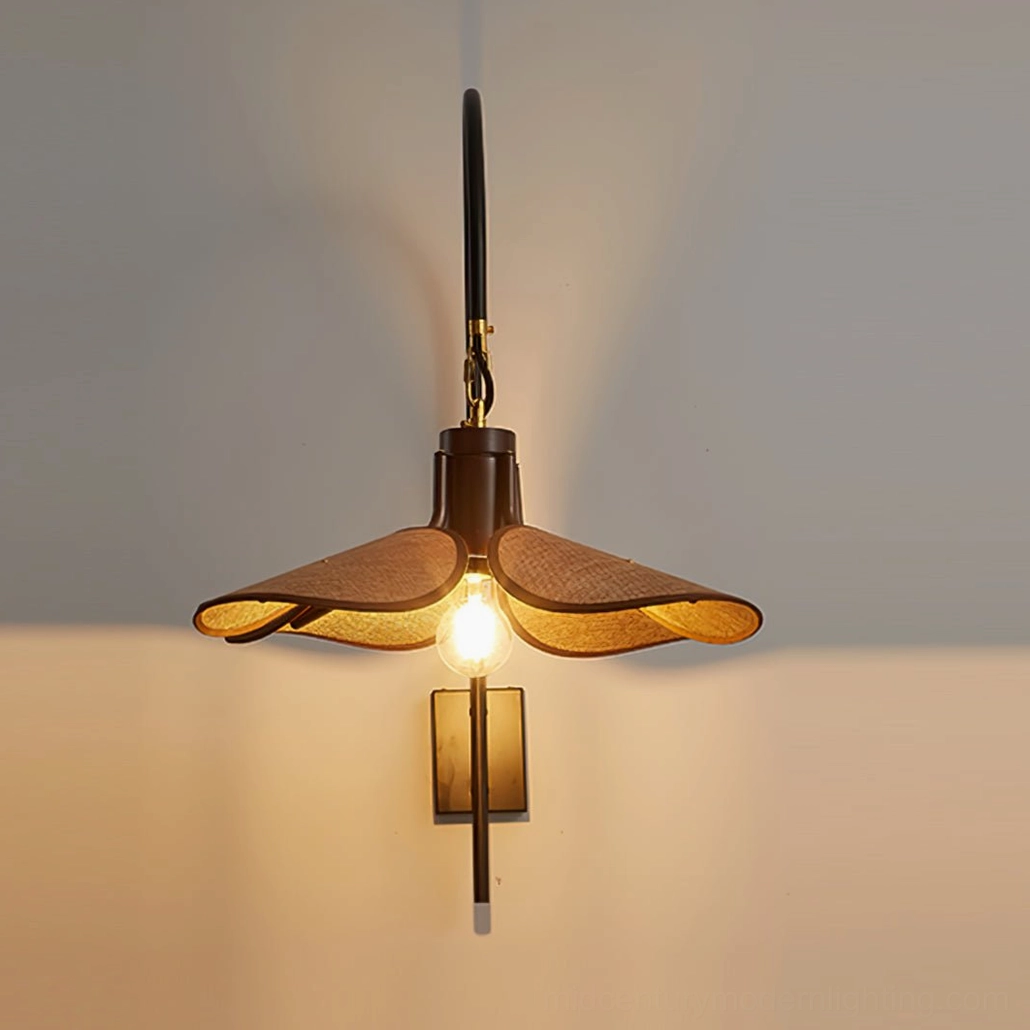 Vintage-style metal wall lamp with warm brass hardware accents and brown fabric shade