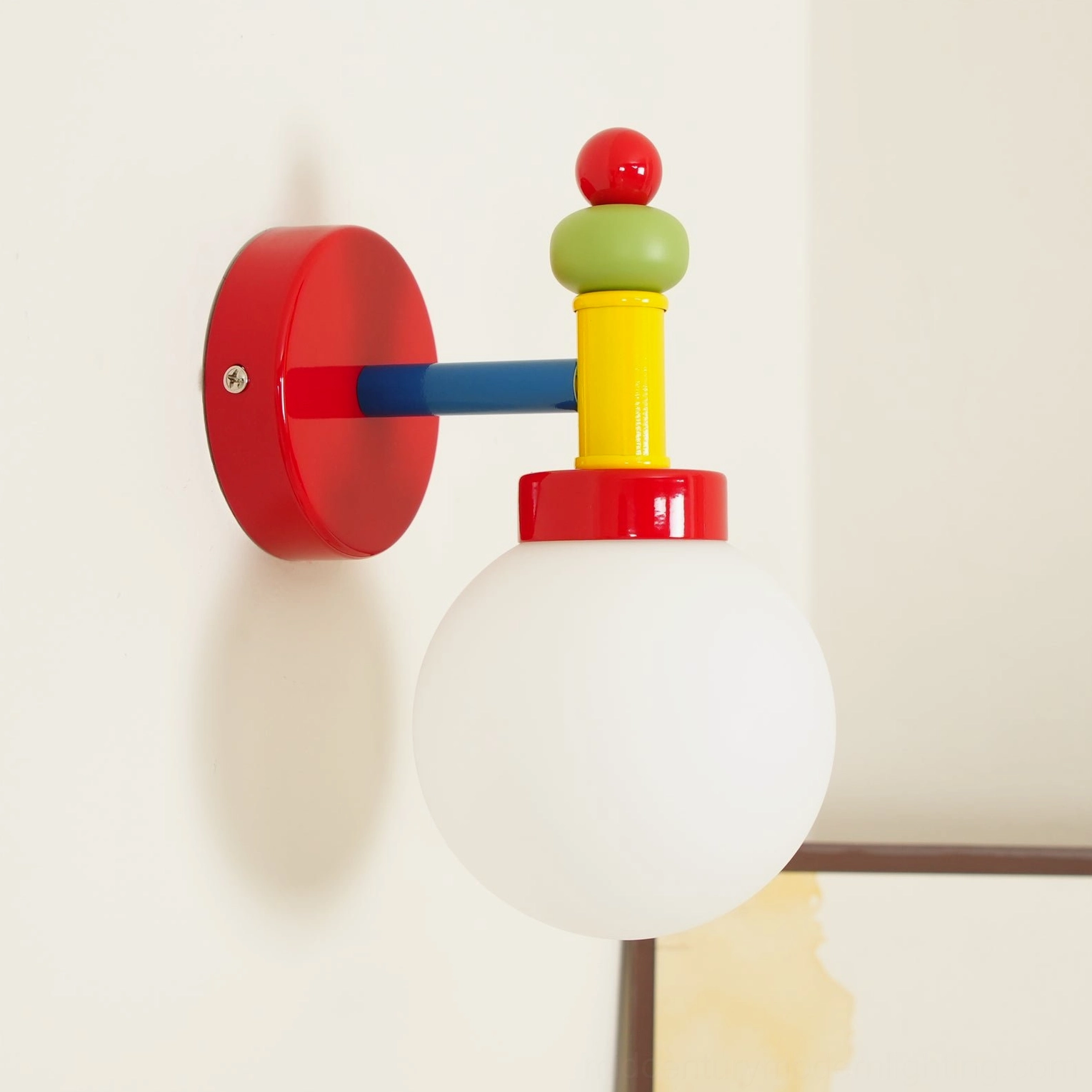 Side profile of mid-century design wall sconce showing metal framework and glass globe