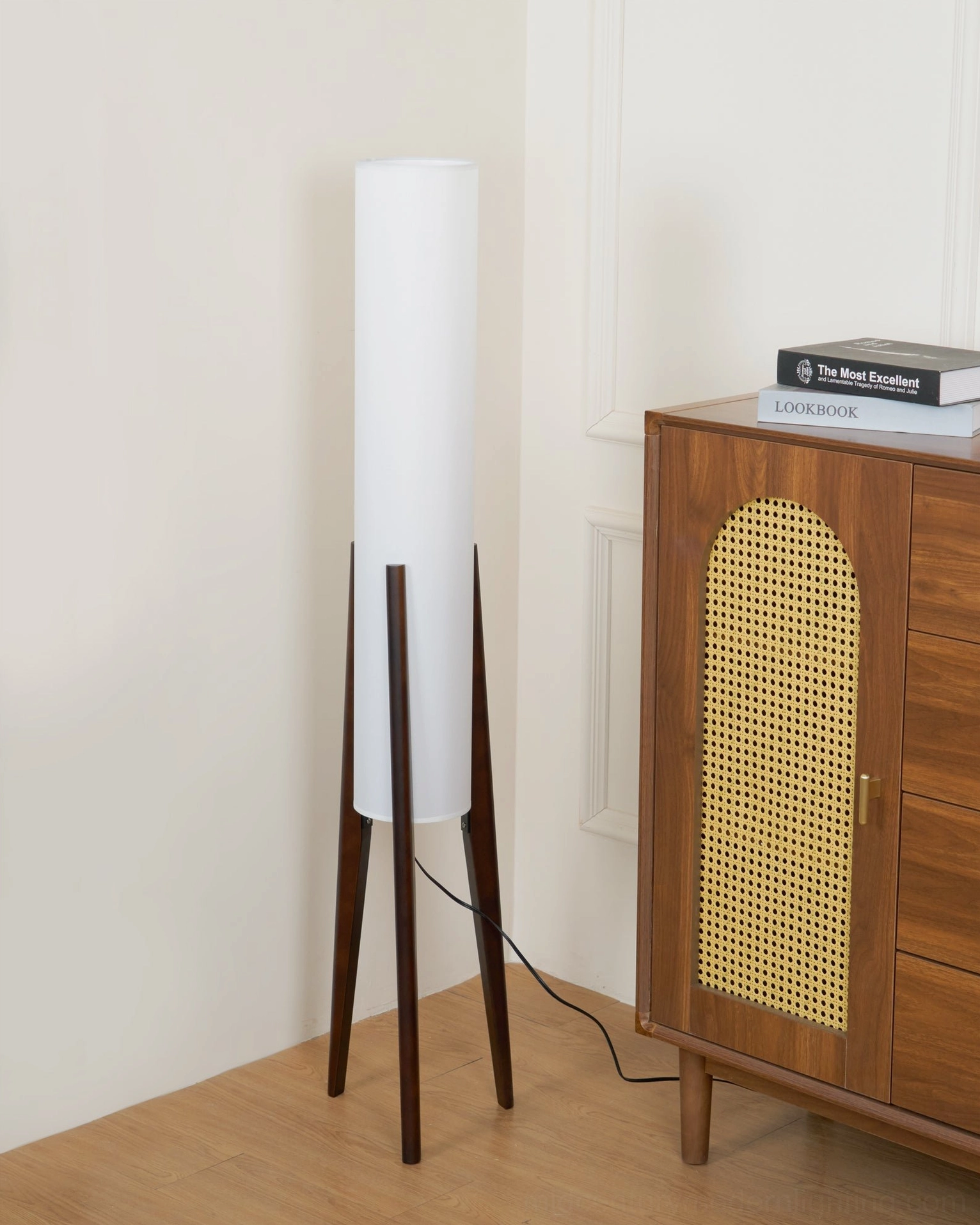 Walnut wood tripod floor lamp with white linen shade in contemporary home design setting