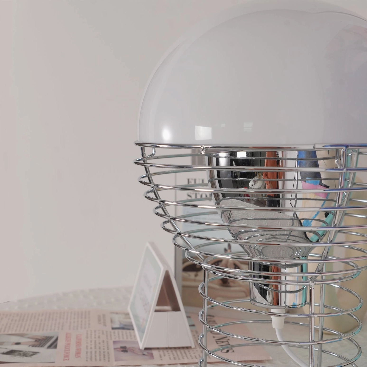Mid-century modern wire cage lamp styling with interior design elements background