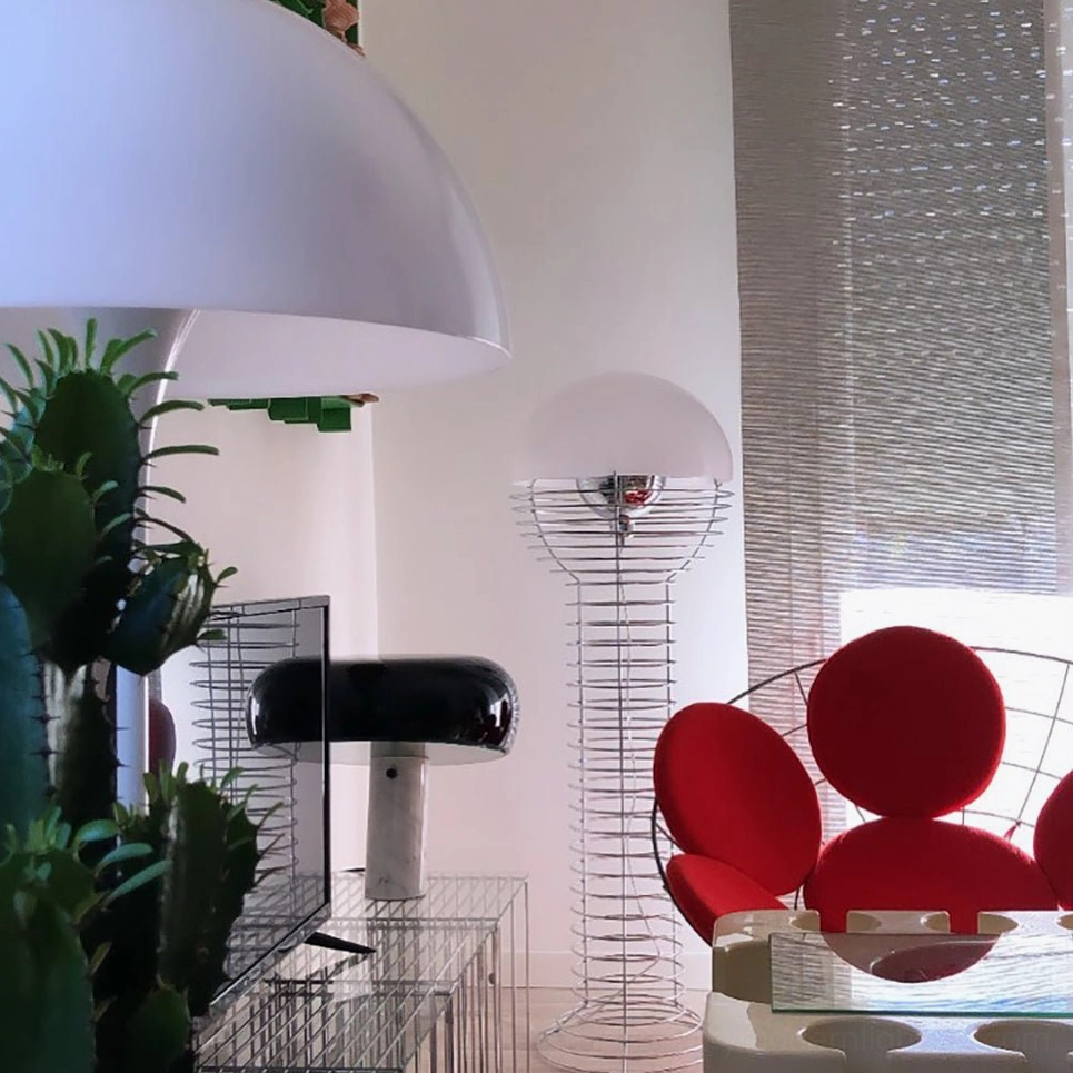 Mid-century modern wire floor lamp showing light distribution through white shade with metal reflector