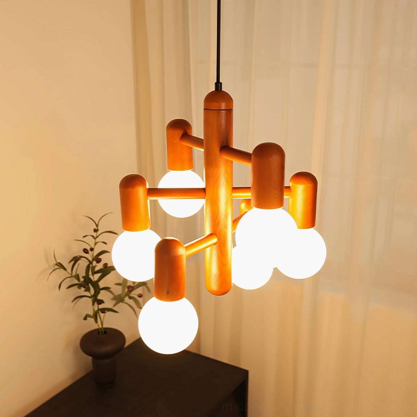 Lit wooden pendant fixture creating cozy ambient lighting in Scandinavian interior