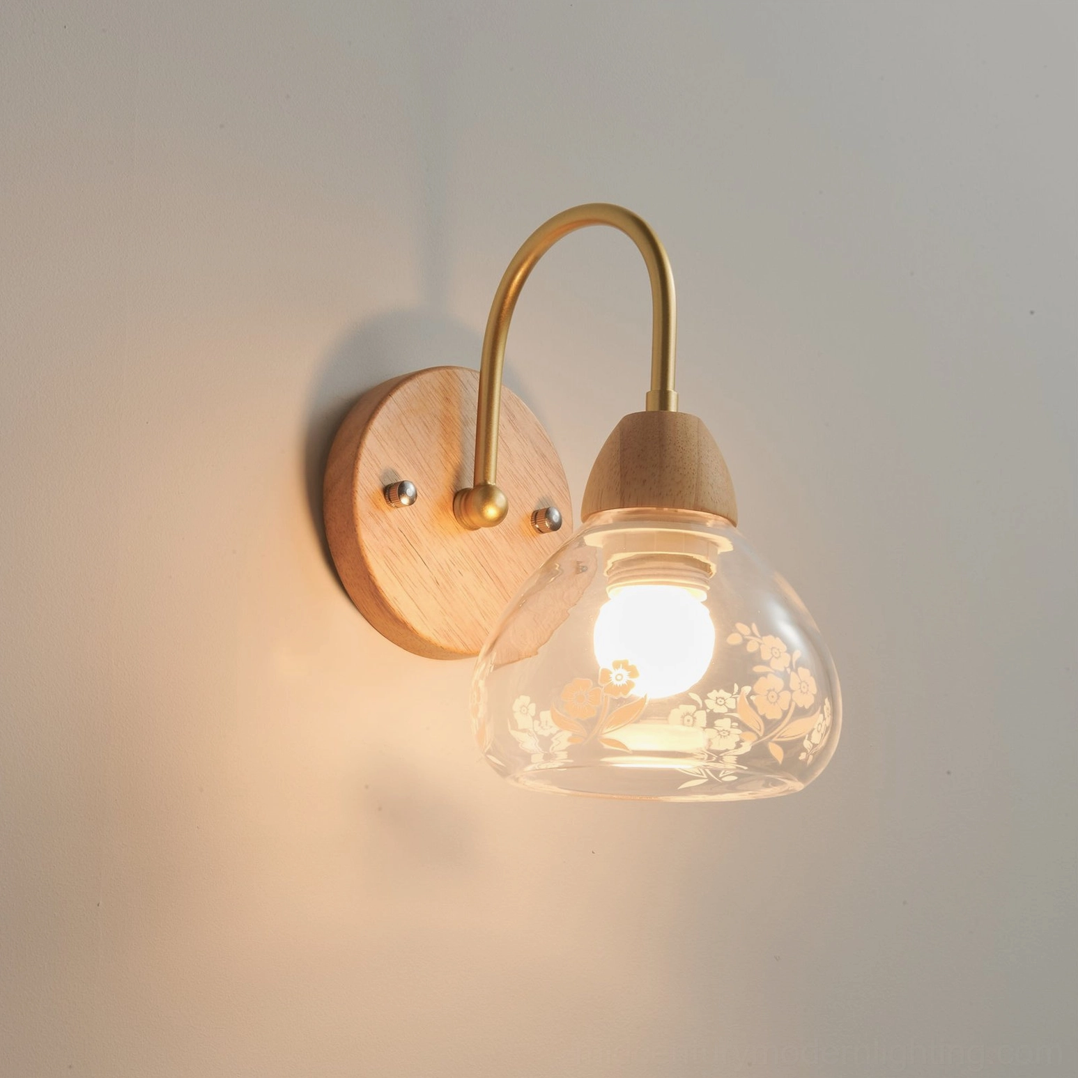 Wooden wall sconce displaying mid-century modern aesthetic with curved metal arm
