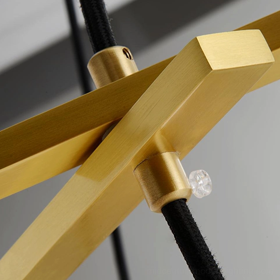 Miira Chandelier close-up detail of brushed gold brass joint hardware and black fabric suspension cord