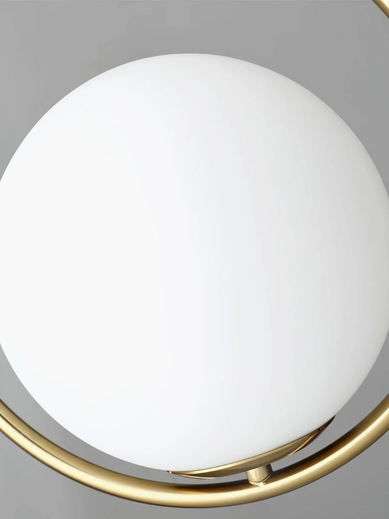 Mila pendant light showing brass and glass construction, hand-crafted suspended lighting fixture mid-century modern aesthetic