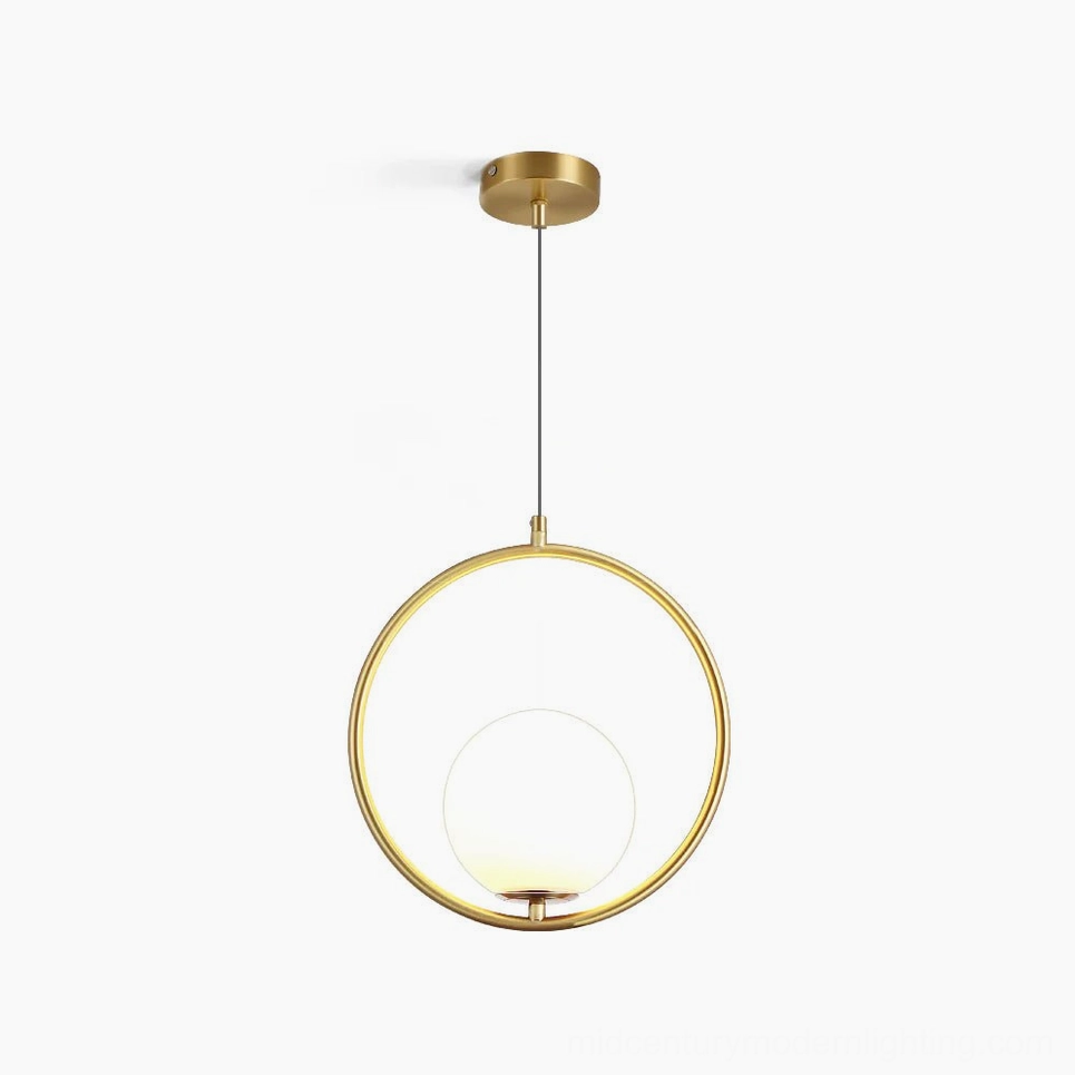 Mila hand-blown glass pendant lamp with brass frame and frosted white shade on white background, circular design mid-century modern lighting