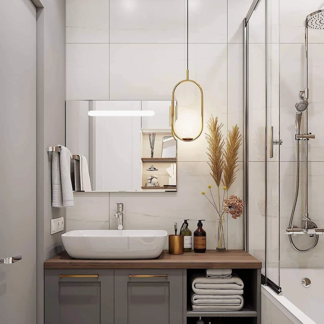 Mila brass pendant lamp with frosted white glass shade, direct product view showing craftsmanship and metal framework detail