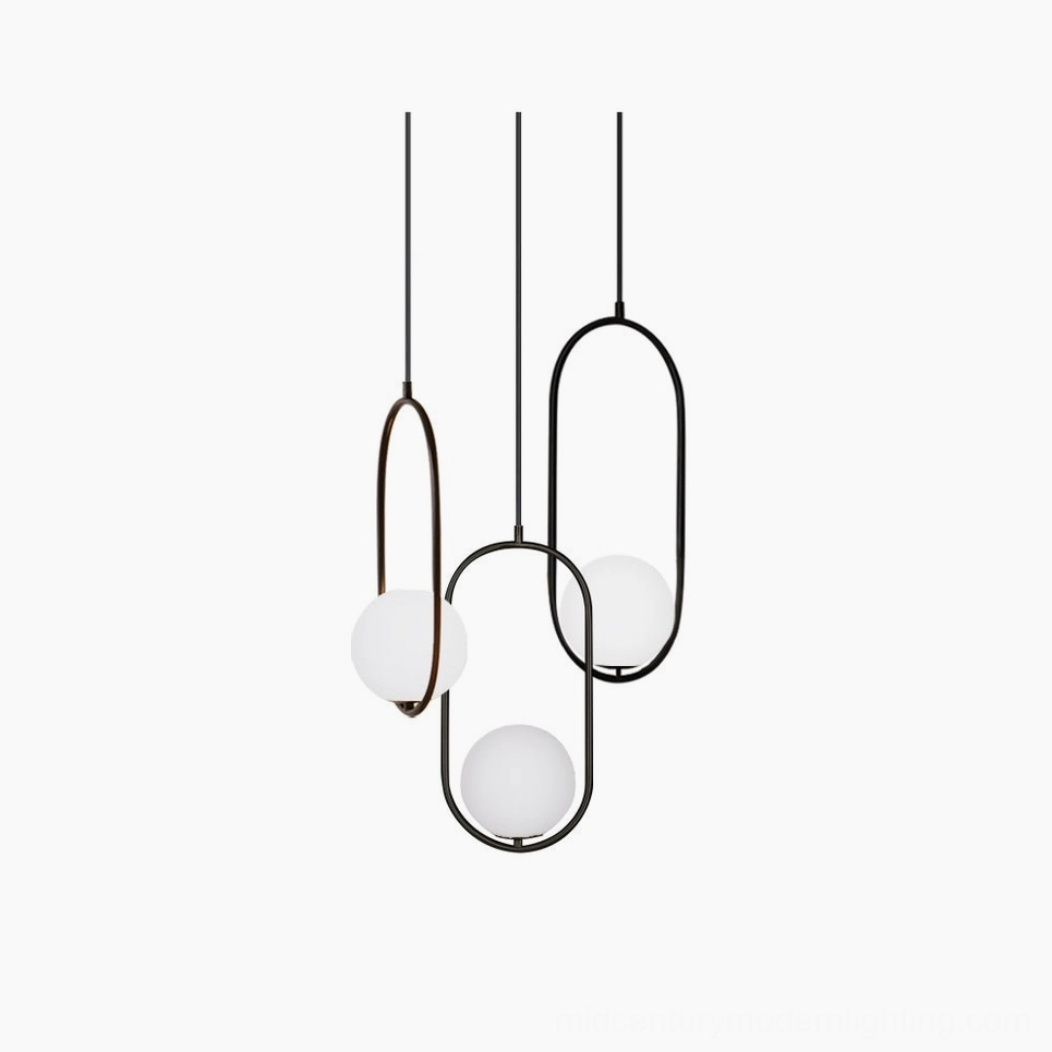 Mila pendant light cluster featuring 3, 5, and 7-head configurations in matte black with frosted white glass spheres - modern minimalist design