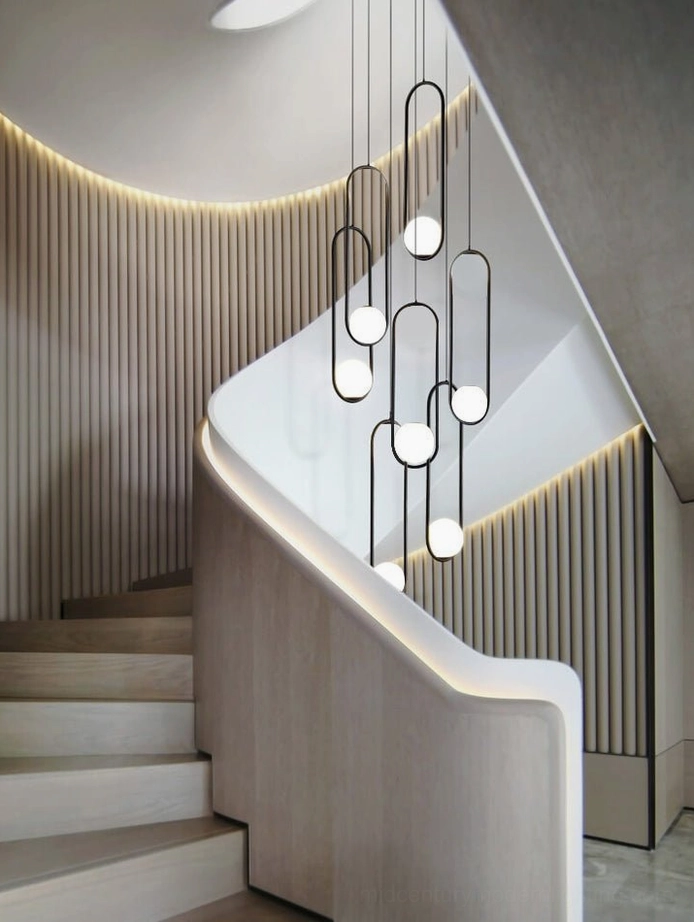 Mila curved staircase pendant lights with integrated warm lighting and ribbed wall details in luxury minimalist interior