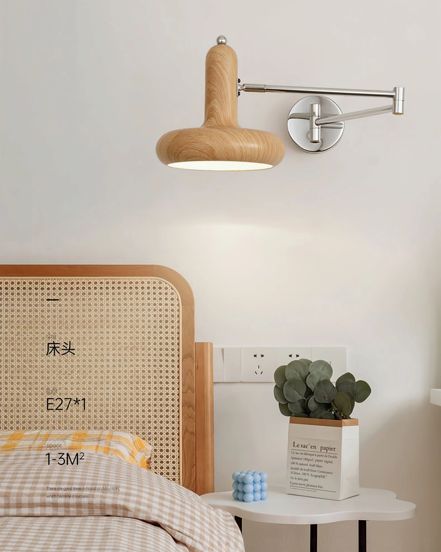 Milena compact swing arm wall sconce with light wood finish positioned at small bedroom nightstand for focused task lighting