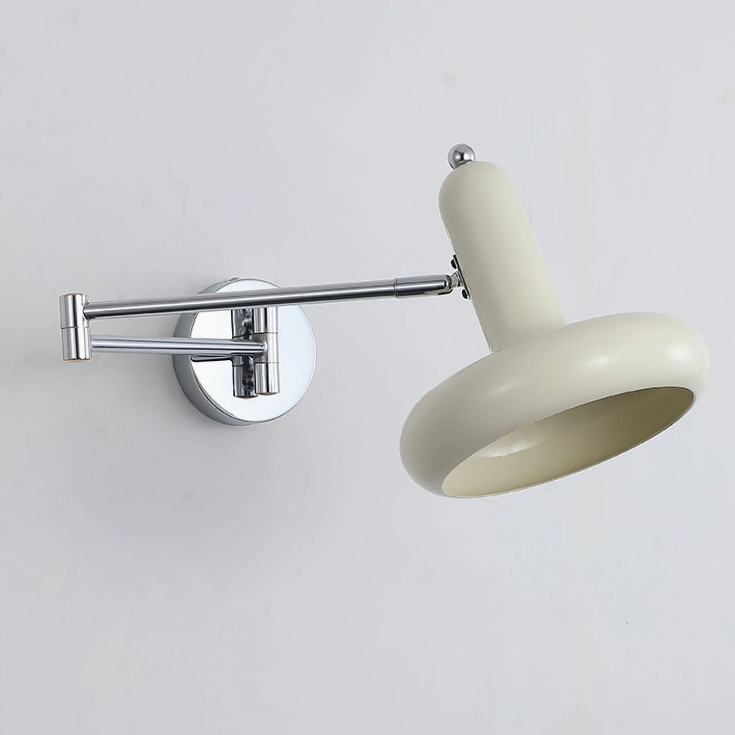 Milena adjustable swing arm wall lamp with natural wood grain finish, side-mount installation in Scandinavian bedroom setting